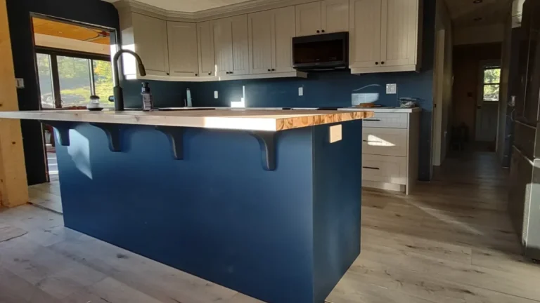 Alternate view of a bespoke navy resprayed kitchen island with seating and matching navy Samsung Bespoke appliances in Campbellville.