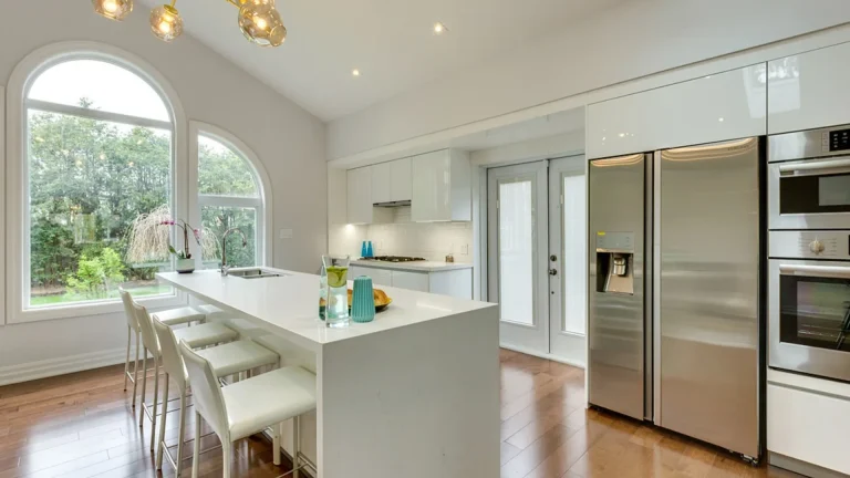 Custom kitchen and great room construction in a Burlington home featuring a cathedral ceiling addition.