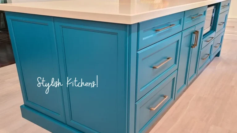 This stunning custom kitchen island design features an aqua-blue finish, a microwave, and a quartz top.