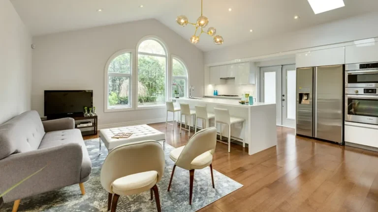 Kitchen remodeling transforms a spacious great room with a modern kitchen.