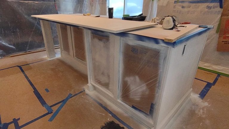 Kitchen restyling before transformation. Prepped and primed, ready for finish coat.