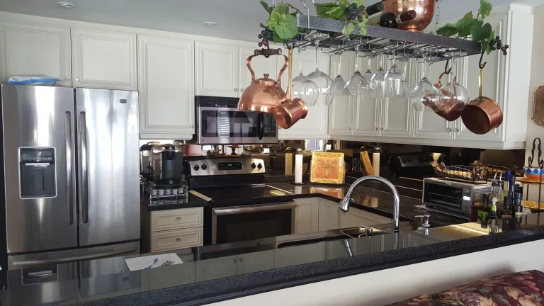 White seamless shaker kitchen reface in a New Street Burlington condo with black granite.