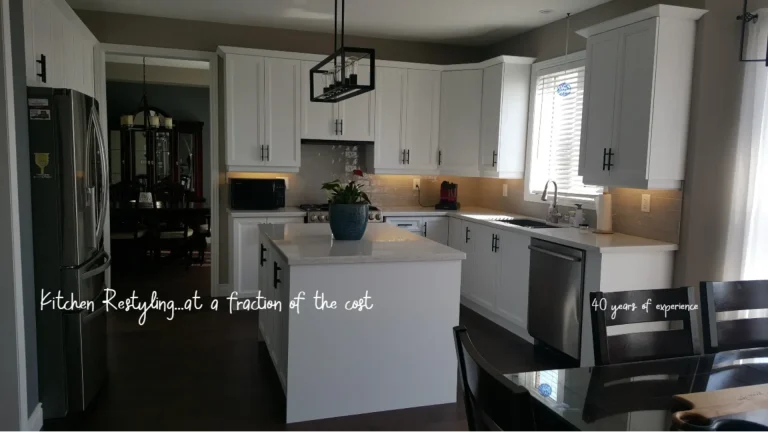 White shaker five panel cabinets with Caesarstone quartz and hand scraped hardwood in a Burlington kitchen.